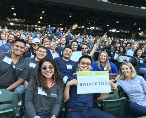 Seattle team holding Swinerton sign at baseball stadium
