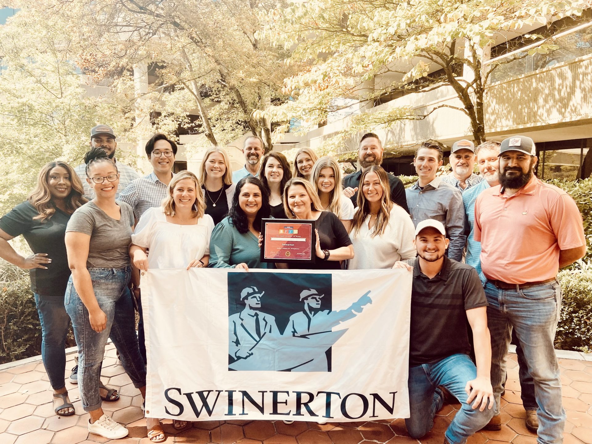 Atlanta Swinerton Employees Holding Best Place to Work Plaque