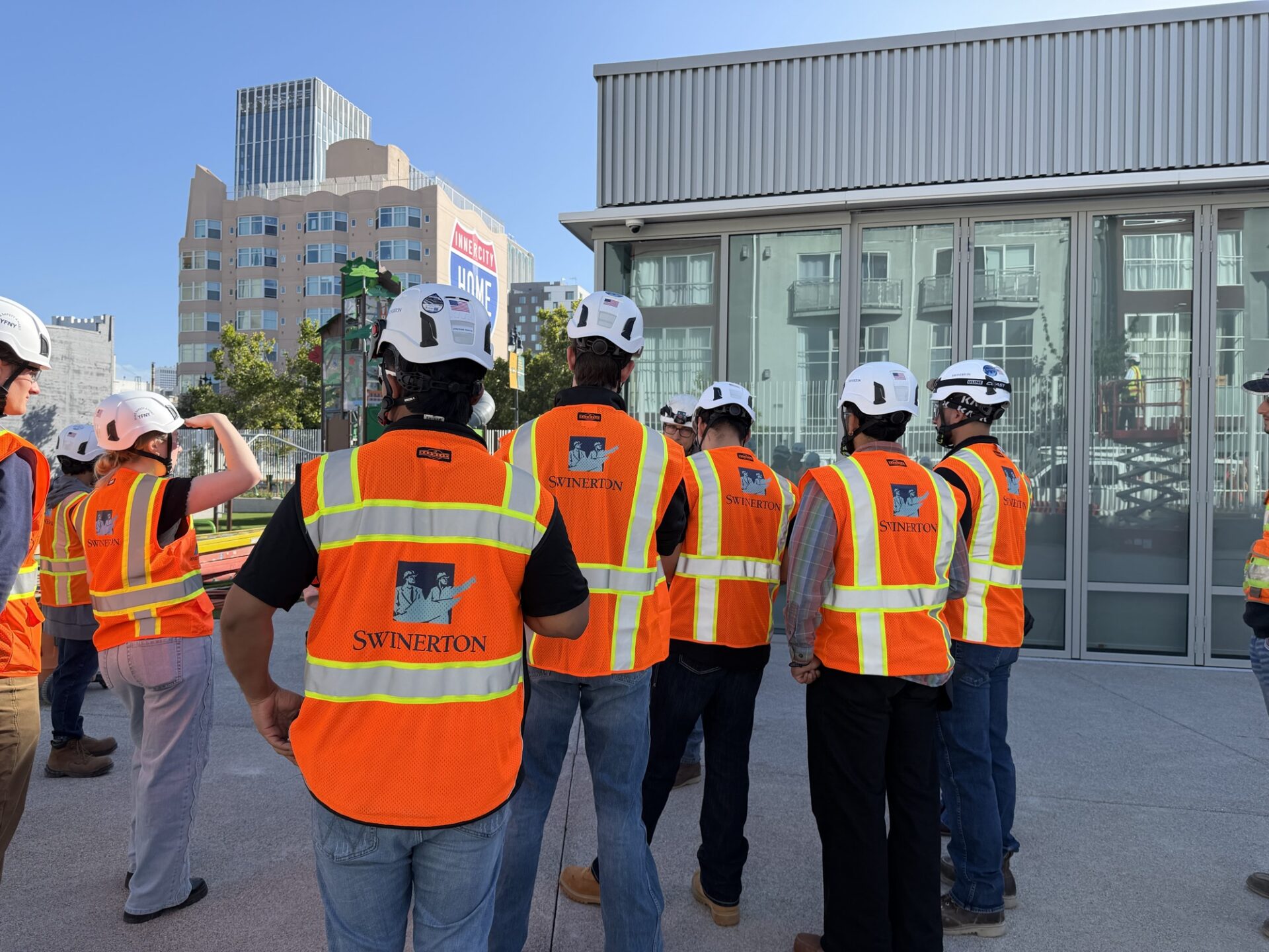Interns walking an active Swinerton jobsite